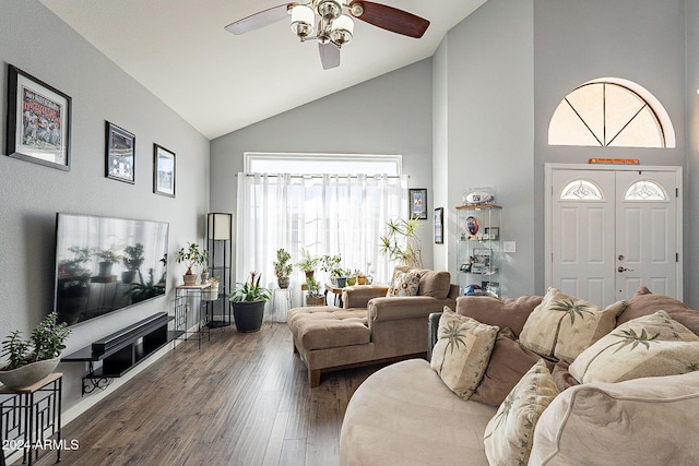 living room with ceiling fan, dark hardwood / wood-style floors, a healthy amount of sunlight, and high vaulted ceiling