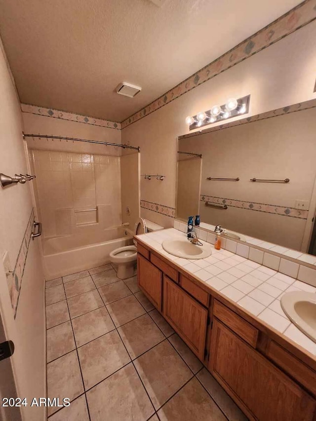 3853 W Calle Lejos, Glendale, AZ 85310 - bathroom with double vanity, tile patterned flooring, washtub / shower combination, and a textured ceiling