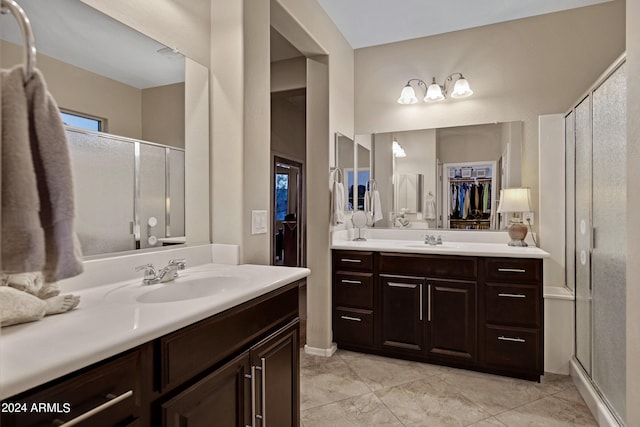 bathroom with vanity and an enclosed shower