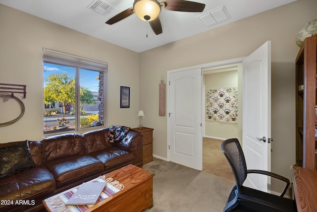 carpeted home office with ceiling fan