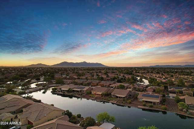 aerial view at dusk with a water and mountain view