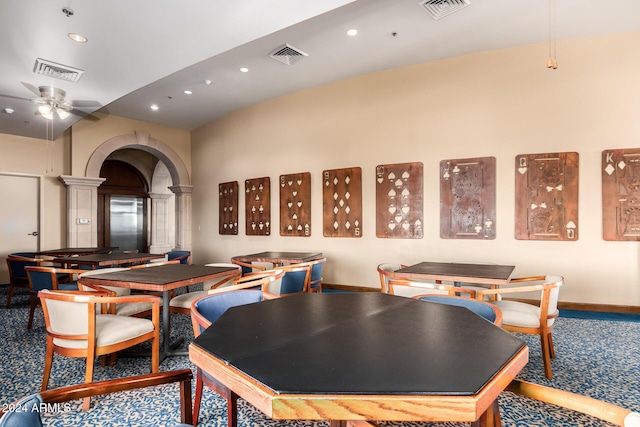 rec room featuring ceiling fan, carpet floors, and decorative columns