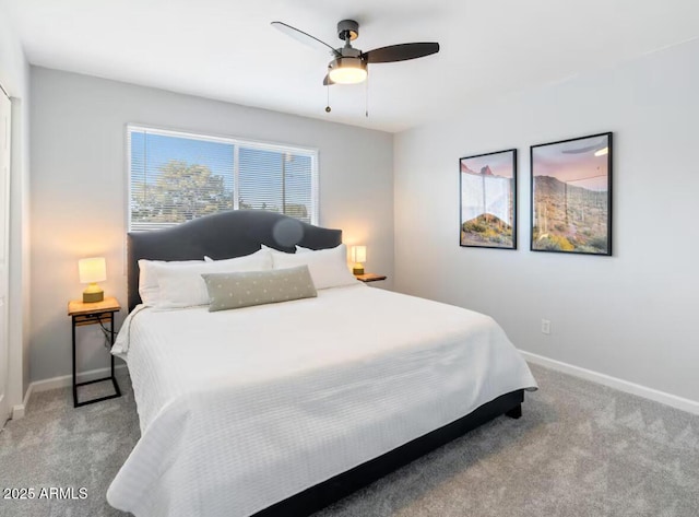 bedroom featuring light colored carpet and ceiling fan