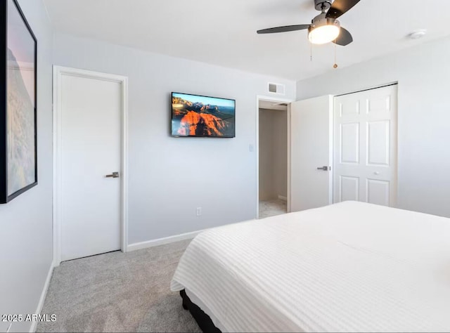 carpeted bedroom with ceiling fan