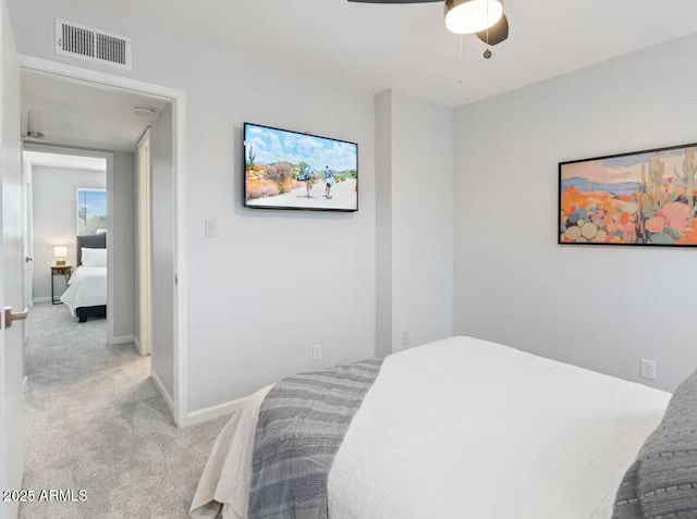 carpeted bedroom featuring ceiling fan