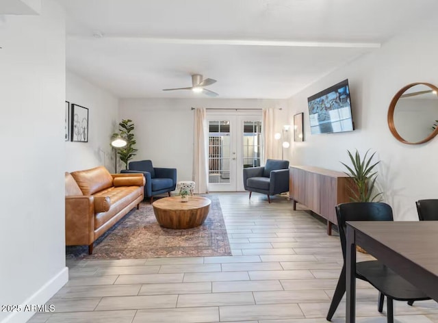 living room featuring ceiling fan and french doors