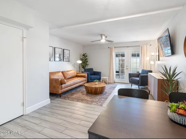 living room featuring french doors and ceiling fan