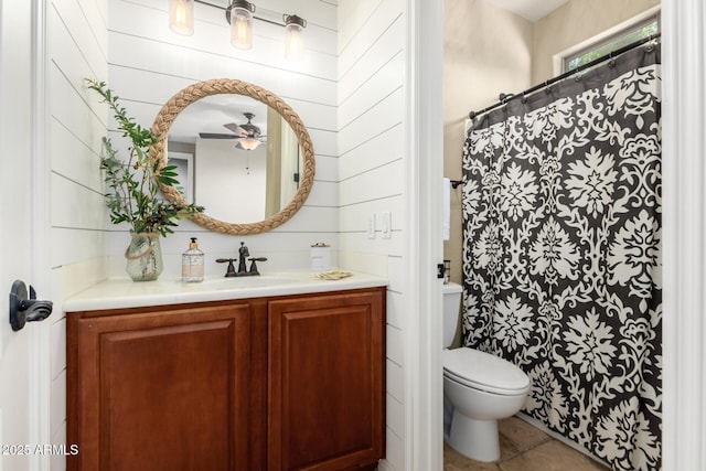 530 S Emerson St, Chandler, AZ 85225 - bathroom featuring vanity, ceiling fan, toilet, tile patterned floors, and wooden walls