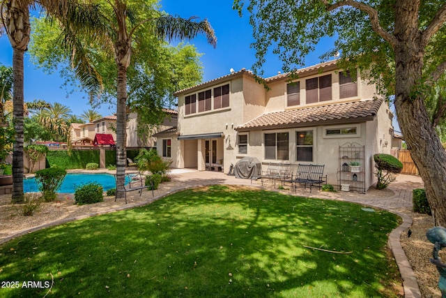 530 S Emerson St, Chandler, AZ 85225 - rear view of house featuring a tiled roof, stucco siding, a patio, an outdoor pool, and french doors