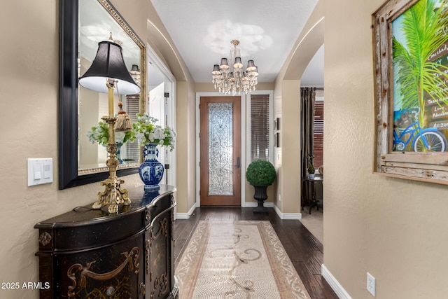 530 S Emerson St, Chandler, AZ 85225 - foyer featuring arched walkways, wood finished floors, a chandelier, baseboards, and a textured wall