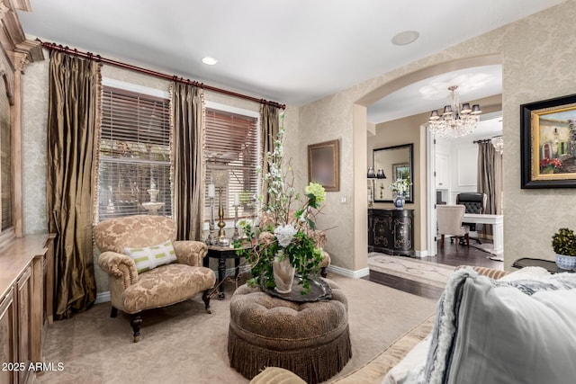 530 S Emerson St, Chandler, AZ 85225 - living room featuring arched walkways, a chandelier, wallpapered walls, and baseboards