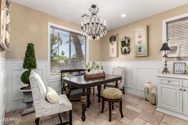 530 S Emerson St, Chandler, AZ 85225 - dining room with a wainscoted wall, a chandelier, stone tile flooring, a decorative wall, and recessed lighting