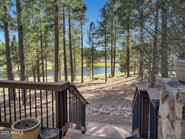 wooden terrace with a water view