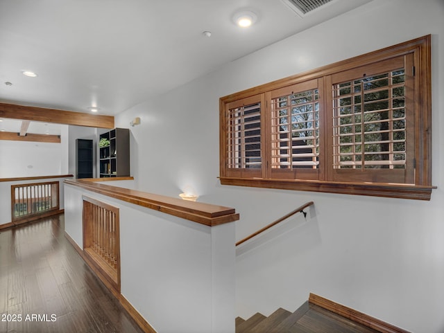 stairs with recessed lighting, visible vents, and wood finished floors