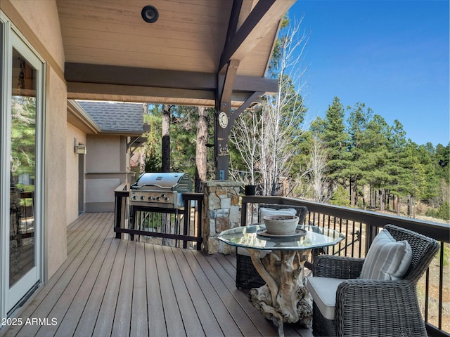 wooden deck with grilling area