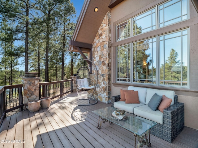 wooden deck featuring an outdoor living space