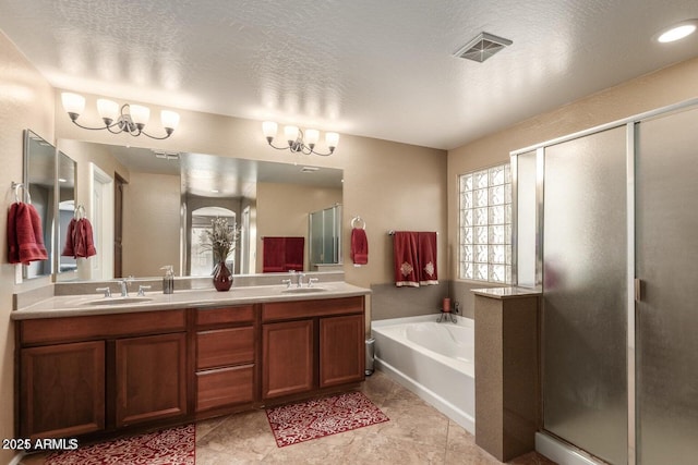 3693 E Sparrow Pl, Chandler, AZ 85286 - bathroom featuring a garden tub, a stall shower, double vanity, and a chandelier