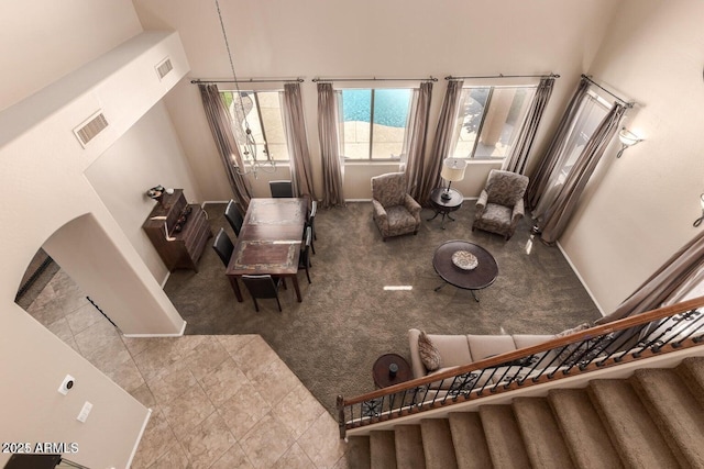3693 E Sparrow Pl, Chandler, AZ 85286 - living area with carpet floors, a towering ceiling, and stairway