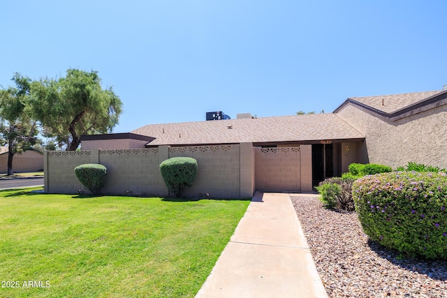17802 N 45th Ave, Glendale, AZ 85308 - view of front facade featuring fence, a shingled roof, a front yard, and a garage