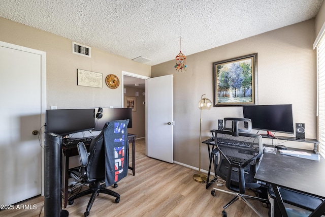 17802 N 45th Ave, Glendale, AZ 85308 - office featuring light wood-type flooring, a textured ceiling, and visible vents