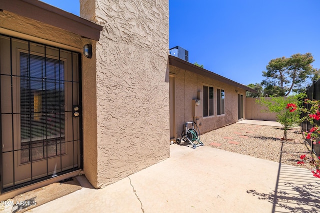 17802 N 45th Ave, Glendale, AZ 85308 - property entrance with a patio area, stucco siding, and fence