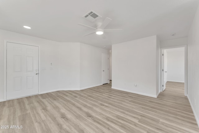 unfurnished room with light wood-type flooring and ceiling fan