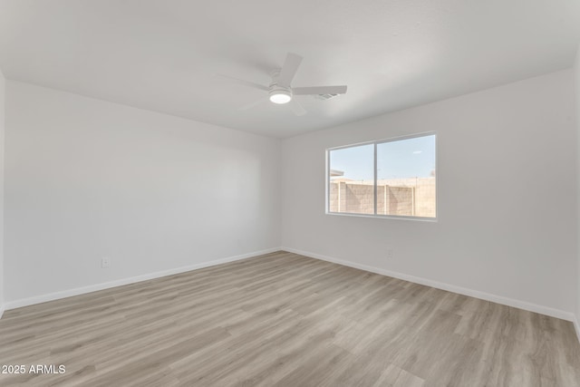 unfurnished room with ceiling fan and light wood-type flooring