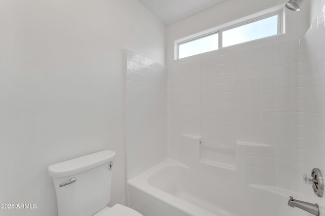 bathroom with shower / bathing tub combination and toilet