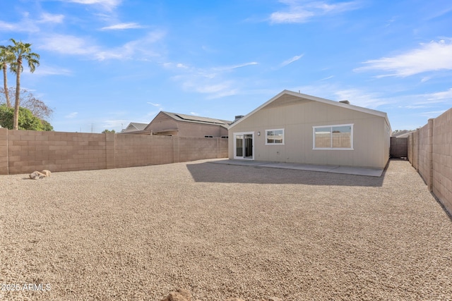 rear view of property featuring a patio