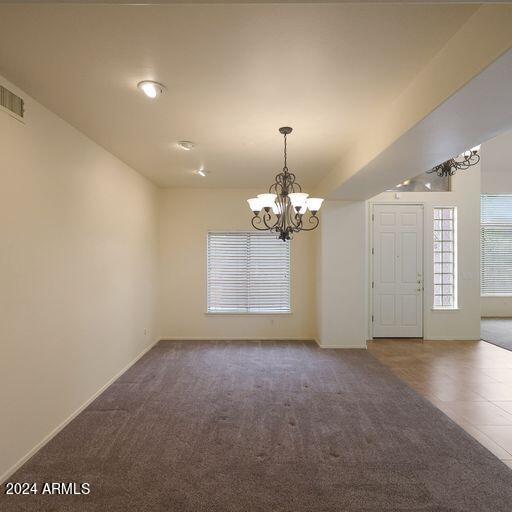 interior space featuring an inviting chandelier