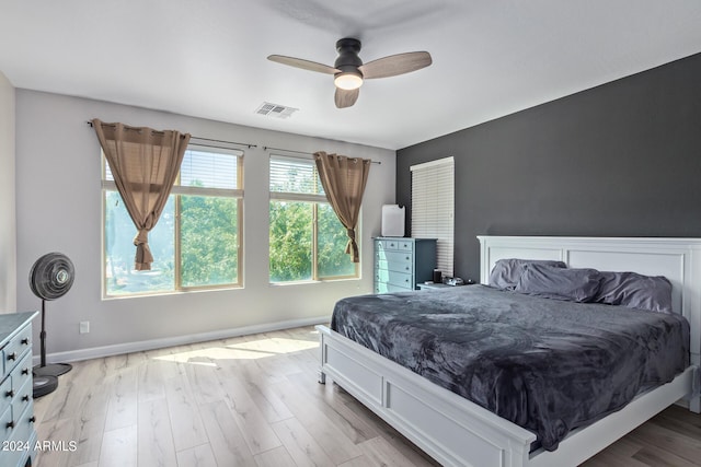 bedroom featuring ceiling fan and light hardwood / wood-style flooring