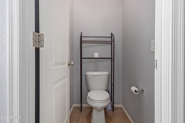 bathroom with tile patterned floors and toilet