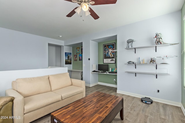 living room with ceiling fan and wood-type flooring