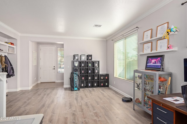 interior space featuring light hardwood / wood-style floors and ornamental molding