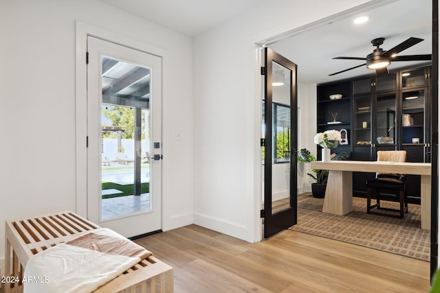 entryway featuring ceiling fan and wood-type flooring