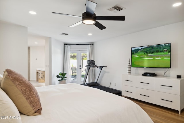 bedroom featuring light wood-type flooring, ceiling fan, ensuite bathroom, french doors, and access to exterior