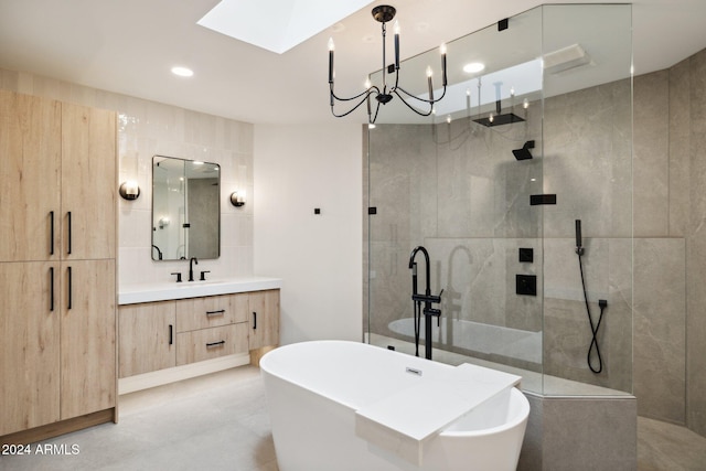 bathroom featuring separate shower and tub, vanity, and tile walls