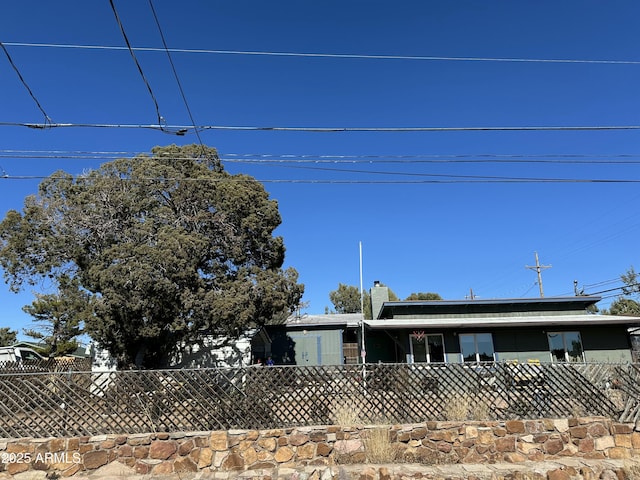 view of front of property featuring a fenced front yard and a chimney