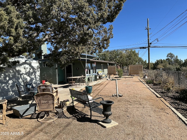 view of patio featuring fence