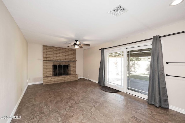 unfurnished living room with ceiling fan and a fireplace