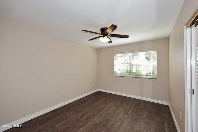 unfurnished room featuring dark wood-type flooring and ceiling fan