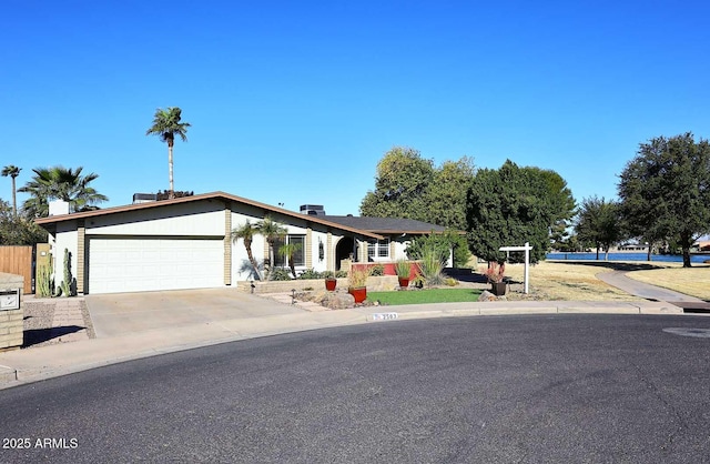 single story home featuring a garage