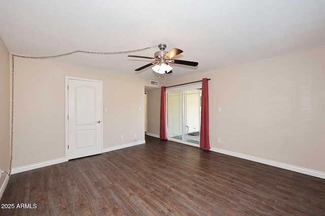 unfurnished room with ceiling fan and dark hardwood / wood-style flooring