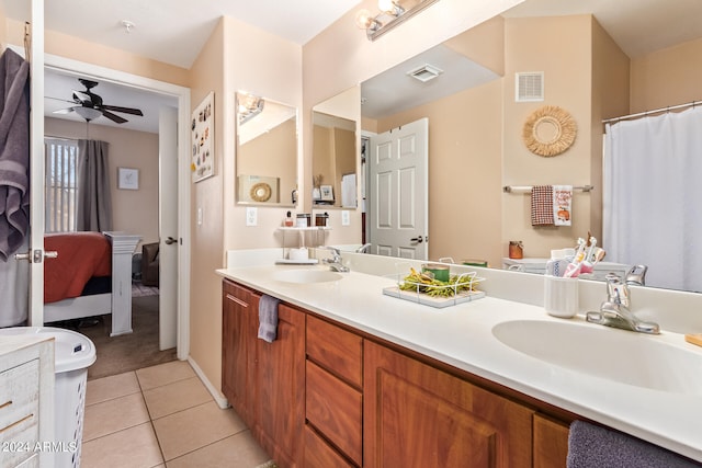 bathroom with vanity, ceiling fan, and tile patterned flooring