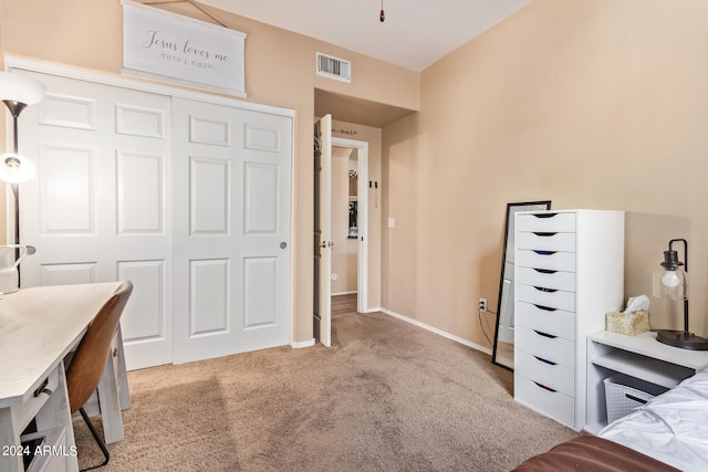 carpeted bedroom featuring a closet