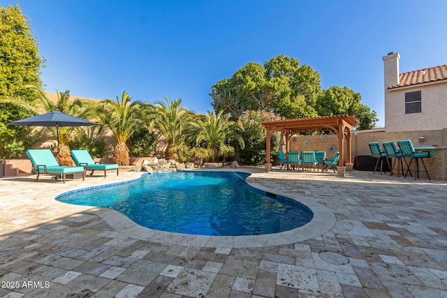 view of swimming pool featuring a pergola, an outdoor bar, and a patio