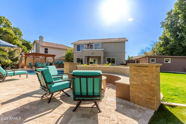 view of patio / terrace featuring a balcony and a pergola