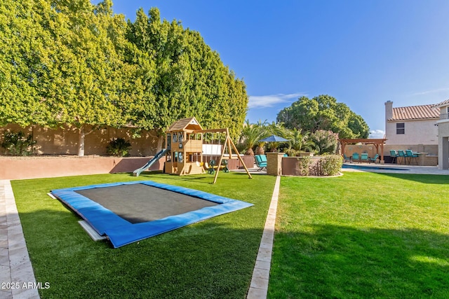 view of playground with a pergola, a trampoline, and a lawn