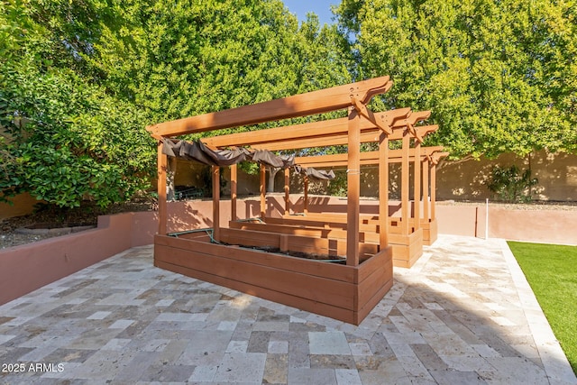 view of patio featuring a pergola