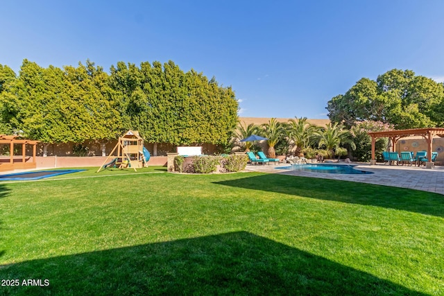 view of yard with a pergola, a playground, and a patio